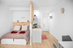 Ένα ή περισσότερα κρεβάτια σε δωμάτιο στο Le Chat Orange