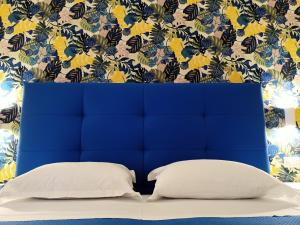 Ένα ή περισσότερα κρεβάτια σε δωμάτιο στο Casa Bocciolino