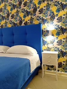 Ένα ή περισσότερα κρεβάτια σε δωμάτιο στο Casa Bocciolino