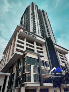 a tall building with a sign on top of it at 1 Tebrau By Elegant Johor Bahru in Johor Bahru