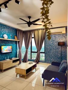 a living room with a couch and a ceiling fan at 1 Tebrau By Elegant Johor Bahru in Johor Bahru