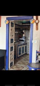 an open door to a kitchen with a stove at Dar mahfoud in Rabat