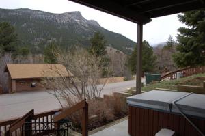 a house with a view of a road and a mountain at Wildwood Inn in Estes Park