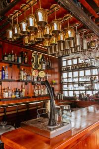 a bar with a sink and copper pots and pans at King's Apartments 301 in Cartagena de Indias