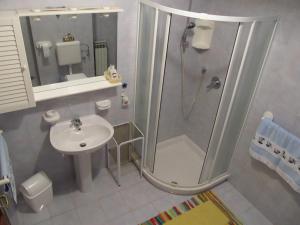 a bathroom with a shower and a sink at Apartments Ruby in Funtana +74 photos