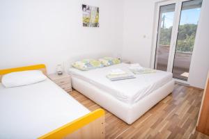 Postel nebo postele na pokoji v ubytování Apartment Bura