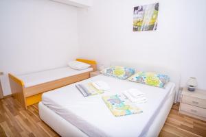 Postel nebo postele na pokoji v ubytování Apartment Bura