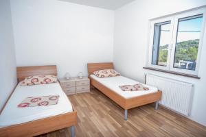 Postel nebo postele na pokoji v ubytování Apartment Bura
