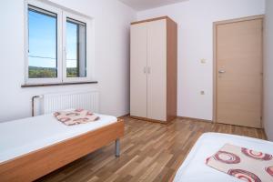 Postel nebo postele na pokoji v ubytování Apartment Bura