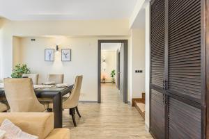 a dining room with a table and chairs at B41 Apartment Poiana Brasov in Poiana Brasov