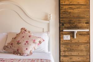 Postel nebo postele na pokoji v ubytování B&B Podere Curtatone