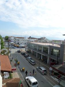 a city street with cars parked on the street at Villa Nikolas in Paralia Katerinis