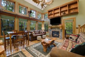 a living room filled with furniture and a fireplace at 734 Disciples Village Condo in Boyne Falls
