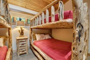 a bedroom with two bunk beds in a cabin at 734 Disciples Village Condo in Boyne Falls