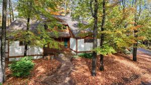 an aerial view of a house in the woods at 734 Disciples Village Condo in Boyne Falls