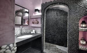 a bathroom with a sink and two mirrors at Villa Mon Rêve "5-minute walk beach, restaurants, supermarket" in Mýkonos City