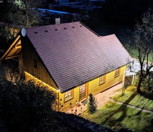 a large yellow house with a brown roof at Eckert Ferienhaus Eslarn in Eslarn