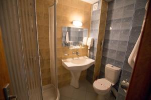 a bathroom with a sink and a toilet and a shower at Terra Europe Brontes Hotel in Targovishte