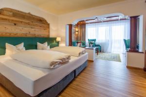 Łóżko lub łóżka w pokoju w obiekcie Hotel Seelos