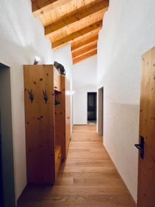 a hallway with wooden lockers in a building at Alpenresidenz - CharmingStay in Flumserberg