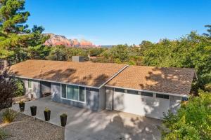 an aerial view of a house with a mountain in the background at Trendy 3BR in Sedona: Hot Tub/Fire-pit /Central Location in Sedona