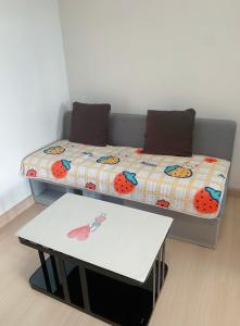 Llit o llits en una habitació de Supalai Veranda Rama 9