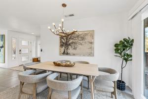 a dining room with a table and chairs at Trendy 3BR in Sedona: Hot Tub/Fire-pit /Central Location in Sedona