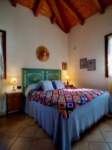 Tempat tidur dalam kamar di Agriturismo Fondo Novelle La Casina