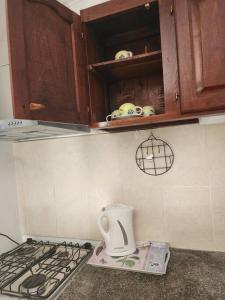 a kitchen with a stove top oven and a counter top at Casa en Santiago del Estero Capital in Santiago del Estero