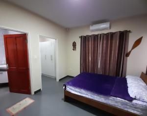 Кровать или кровати в номере Sa-Ra's vakantiehuis