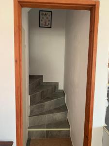 a stairway leading up to a room with a stair case at La Bandolaise à Perdika in Perdika