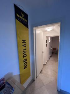 a hallway with a yellow sign on the wall at JAZZ Apartment Centro storico in Perugia