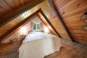 a bedroom with a bed in a attic at R & R Chalet at Mt. Rainier in Ashford