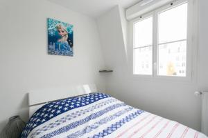 En eller flere senge i et værelse på Big House 2 minutes from Disneyland Paris