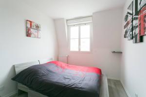 En eller flere senge i et værelse på Big House 2 minutes from Disneyland Paris + 2 billeder