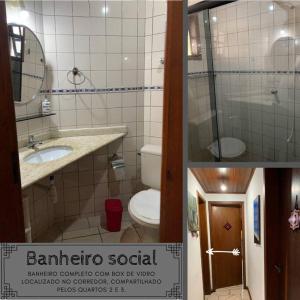 bagno con servizi igienici, lavandino e specchio di Morada dos pássaros Boracéia a Bertioga