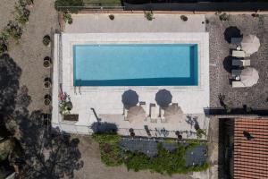 an overhead view of a swimming pool with chairs at Anilde, house with private pool, Colle di Val d'Elsa, Toscana in Colle di Val d'Elsa +29 photos
