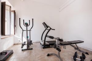a gym with two exercise bikes in a room at Anilde, house with private pool, Colle di Val d'Elsa, Toscana in Colle Val D'Elsa