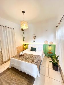 Postel nebo postele na pokoji v ubytování Pousada Villa Real Paraty - Localização e café da manhã EXCELENTES"
