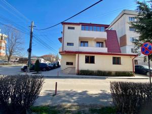 a building on the side of a street at ARMONIA in Filiaşi