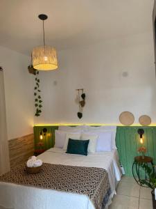 Postel nebo postele na pokoji v ubytování Pousada Villa Real Paraty - Localização e café da manhã EXCELENTES"