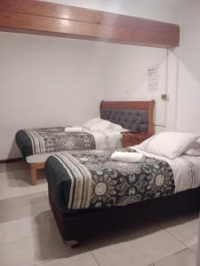 Tempat tidur dalam kamar di Hotel Terrasol Iquique