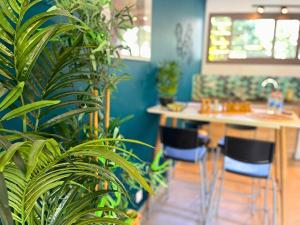 a room with a table and chairs and plants at *Le Royal*Havre De Paix*Wifi* in Marseille