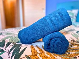 a blue teddy bear sitting on top of a bed at *Le Royal*Havre De Paix*Wifi* in Marseille