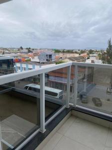 a view of a city from the balcony of a building at Cabo Frio - Temporadas in Cabo Frio