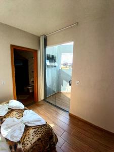 Ένα ή περισσότερα κρεβάτια σε δωμάτιο στο Suite 04 - Avenida Hospedagem