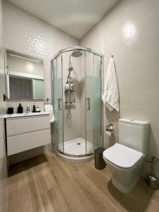 a bathroom with a shower and a toilet and a sink at Urban Oasis La Palma in Santa Cruz de la Palma