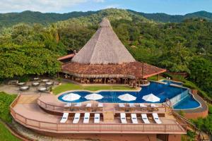 an aerial view of a resort with a swimming pool at Punta Islita, Autograph Collection in Islita