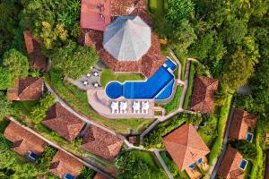 an overhead view of a house with a swimming pool at Punta Islita, Autograph Collection in Islita