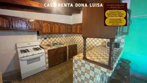 A kitchen or kitchenette at Casa Renta Dona Luisa Hostel